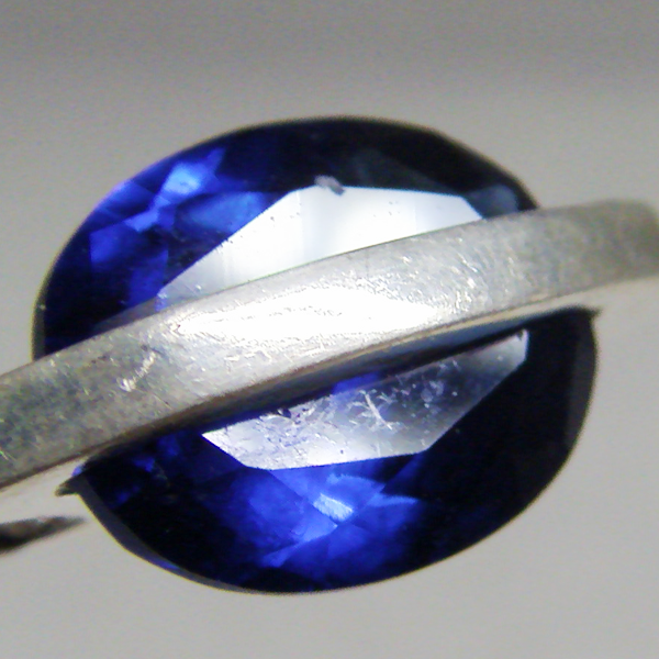 (p1226)Silver pendant with faceted blue stone.